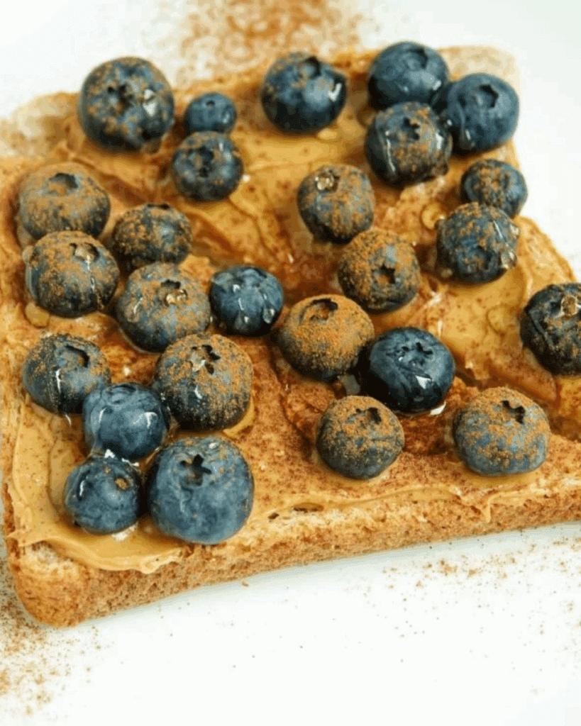 Easy peanut butter blueberry toast 7 toast with peanut butter, blueberries, and a dusting of cinnamon
